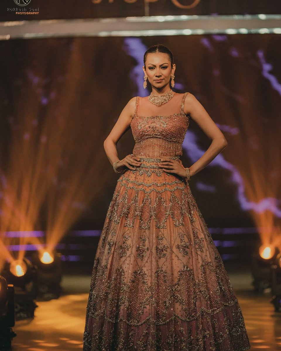 The runway came alive with the stunning display of traditional and contemporary ensembles, reflecting the rich heritage and evolving trends of Indian wedding fashion, leaving the attendees captivated by the beauty and elegance of the showcased bridal and groom's attire.