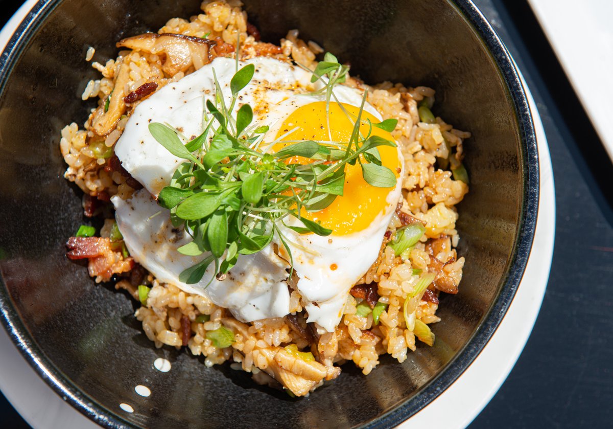 Our Brunch Fried Rice is so incredibly satisfying. Made with bacon, scrambled eggs, green onions, garlic, soy sauce, bean sprouts, chili oil, and a sunny-side-up egg. Savory perfection in a bowl! 🙌🏼 #weekendbrunch #iogodfrey