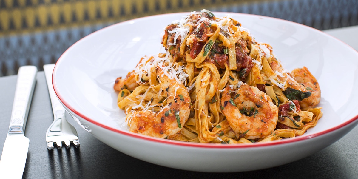 We love carbs, especially in the form of our Spicy Shrimp Fettuccine 😍🦐

Made from scratch, every day, in our kitchen, our handmade pasta is dressed up in this dish with marinara, shrimp, spice, and garnished with parmesan cheese 🍝

Order online at order.farmersrestaurantgroup.com.