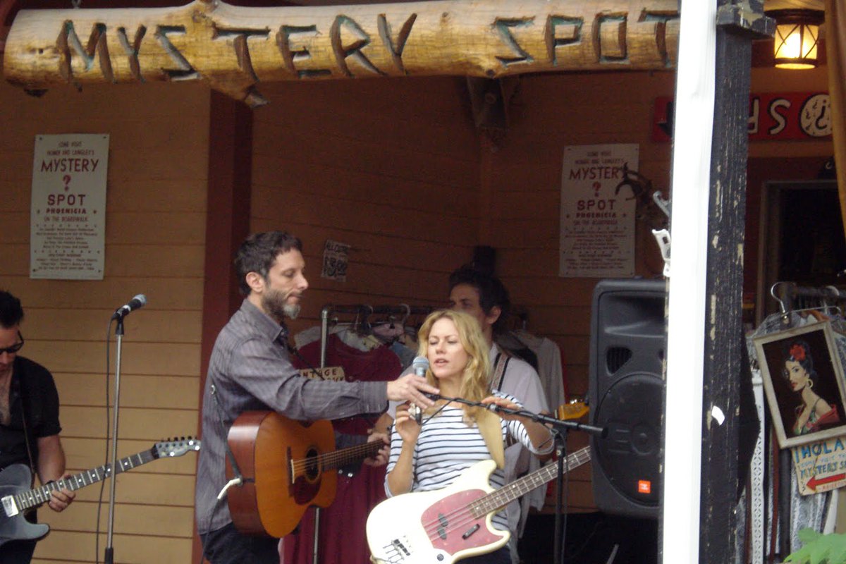 2010 August: Jonathan Donahue, @brittaphillips  and Dean, on a porch in the Catskills. Too bad the set was cut short because of the rain.