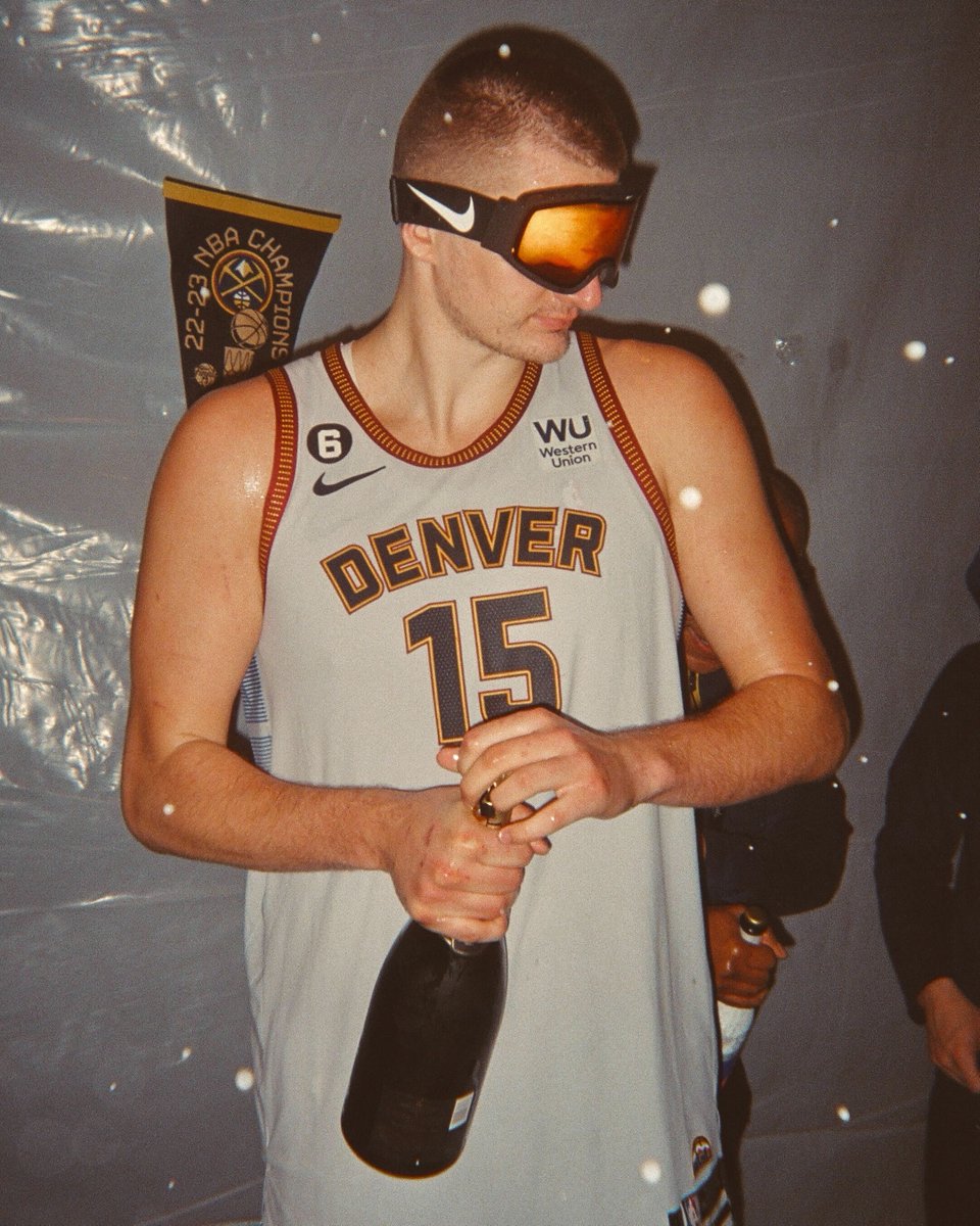 NBA's tweet photo. Championship festivities 🥽🍾

📸 Joker on film https://t.co/faJqezy7a4
