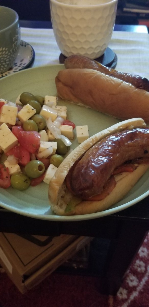 Keto buns sausage. peppers and onions with a tomato salad made by a friend. Delicious lunch! #keto #ketomeals #ketomealsideas #ketodinner #ketodinnerideas #ketobuns #sausage #sausagepeppersandonions #tomatosalad