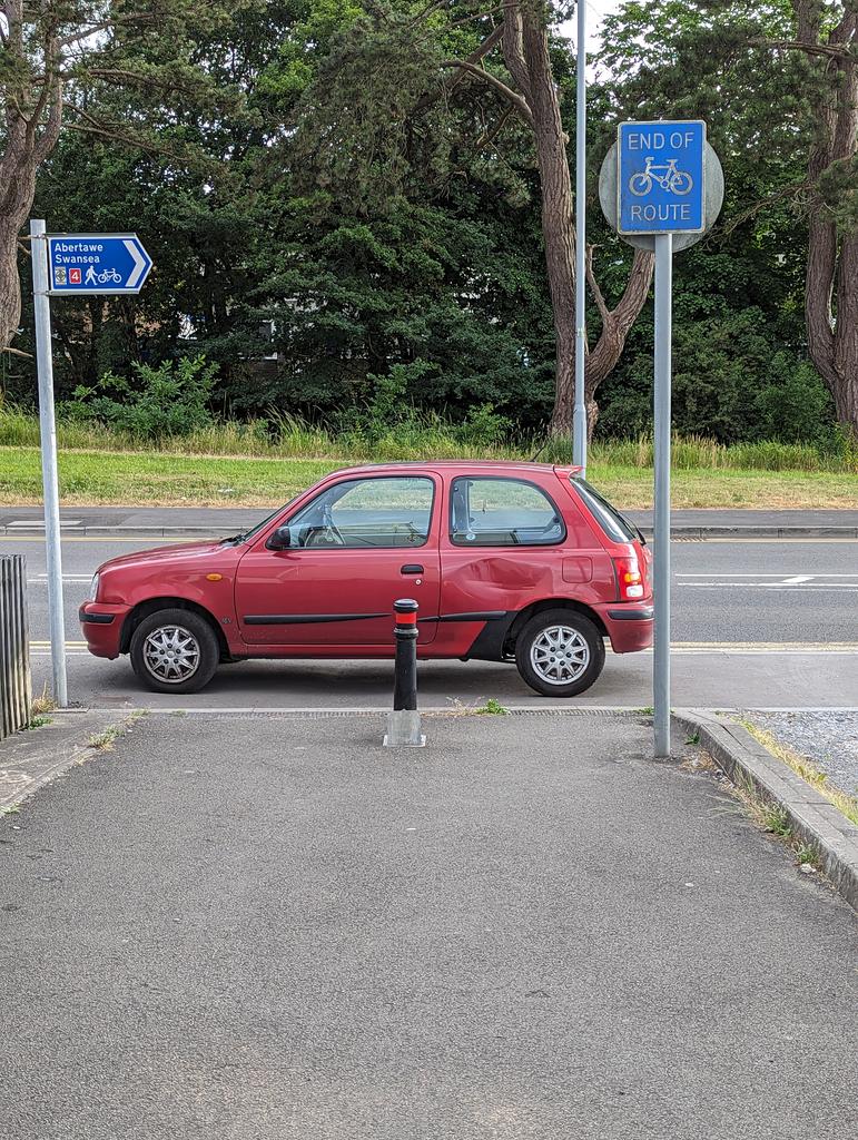 Blocking a cycle path, on the pavement and on double yellows.  Helmetry of the highest order <a href="/YPLAC/">You Park Like a C***</a>