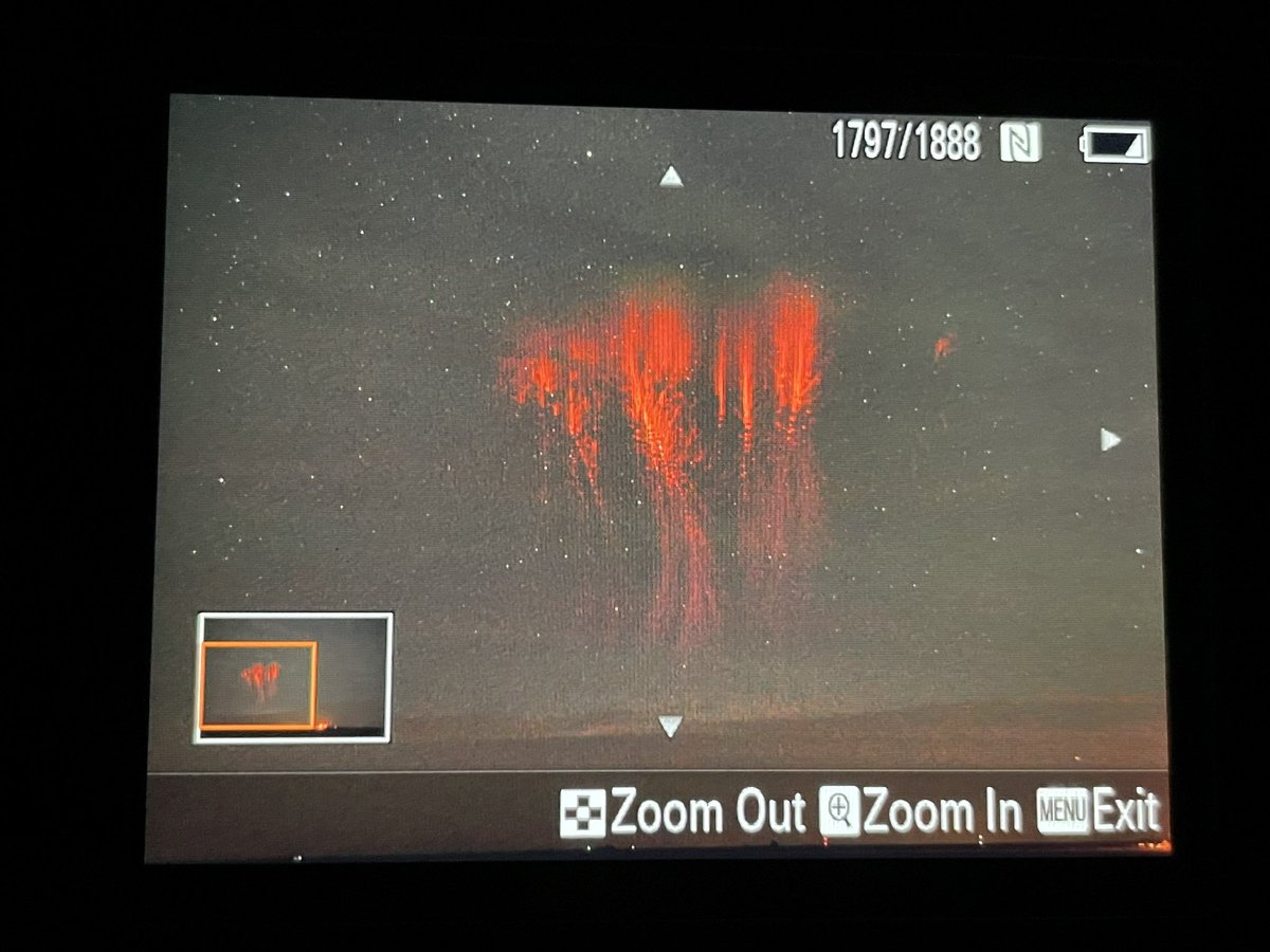 The damaging MCS over Tulsa, OK is spitting out some huge red sprites with green ghosts at the top fringe. Back of the camera from Pampa, TX, in the ballpark of 300 miles away.