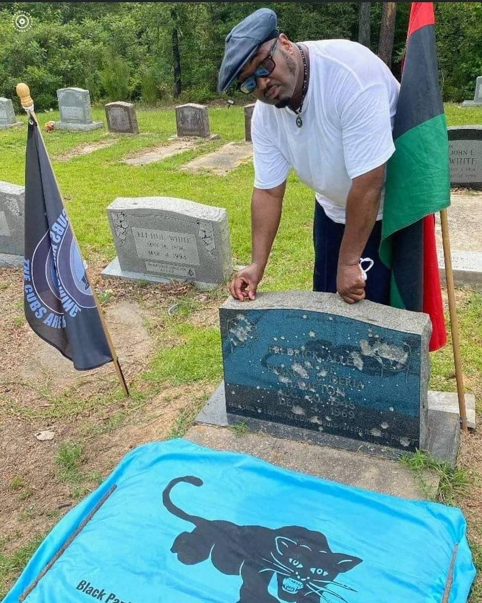 Fred Hampton Jr visiting his father grave site. His gravestone shot up with bullets.  Fred Hampton, revolutionary leader of the Illinois chapter of the Black Panther Party, was executed by the FBI, who discharged 90 rounds of ammunition while he lay in bed. #blackfathers