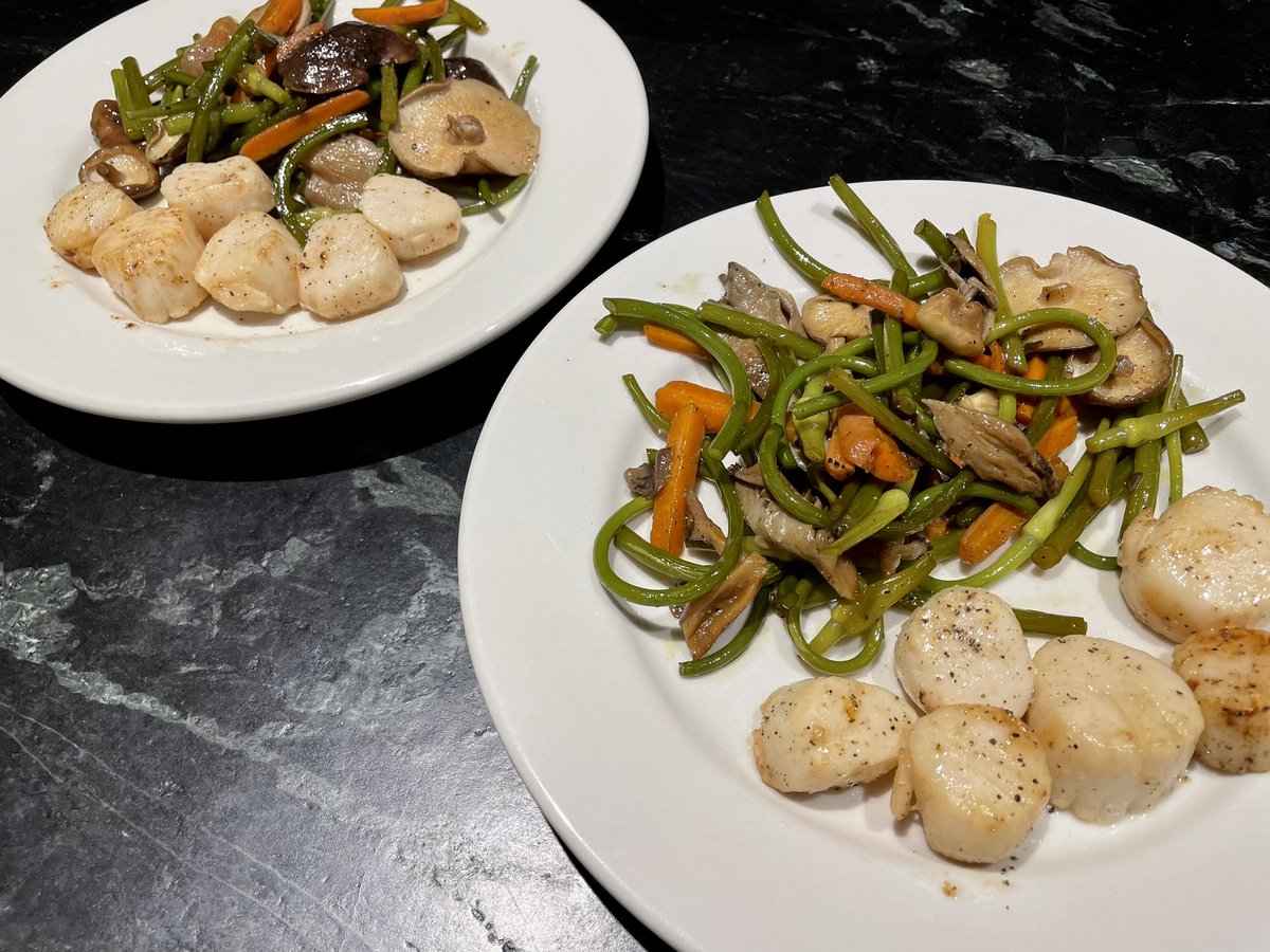 Grilled scallops with sautéed garlic scapes and oyster mushrooms
