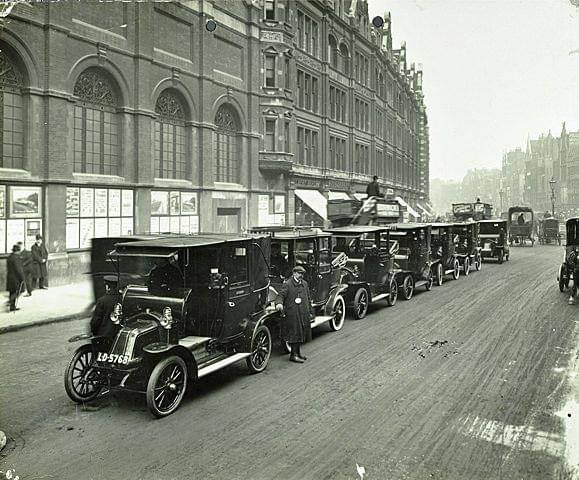 Cab rank in Bishopsgate. London’s first black cabs in the 1890s were electric. Petrol-powered vehicles appeared in 1903.