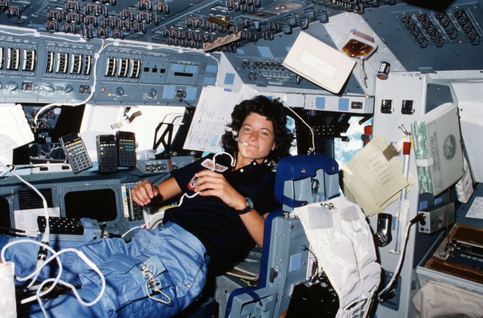 Sally Ride floating in the space shuttle.