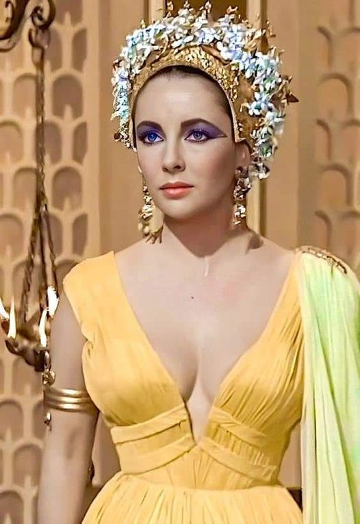 elizabeth taylor gold dress For "Cleopatra", 26.000 costumes were designed, including at least 65 outfit  changes for Elizabeth Taylor, made by Irene Sharaff. One of these included  a 24-carat gold cloth cape that was designed to