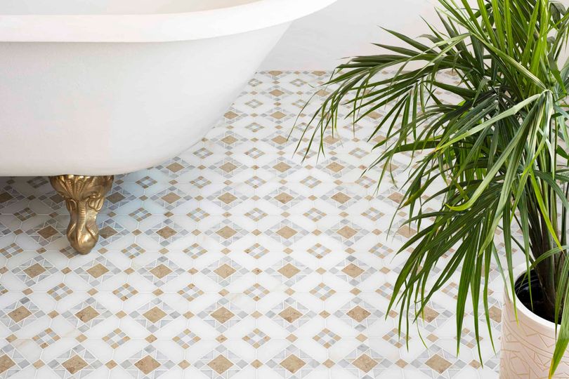 The Starlight mosaic by <a href="/psschatz/">Paul Schatz</a> for New Ravenna is timeless in its ode to Roman architecture, yet modern and fresh in its geometric design and muted tones of honed Calacatta Monet, Carrara, and Jura Beige. #bathroomdesign #handcrafted