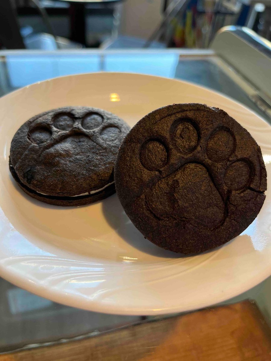 AwuCafe's tweet photo. Bulldog Oreos are the special today!  Filled with our cream cheese frosting, these cookies have a bit of a crunch. Try it with an Oreo affogato. It’s cinnamon roll day and we also have blackberry peach or chocolate chip coconut scones. https://t.co/iE6T0gvL7g