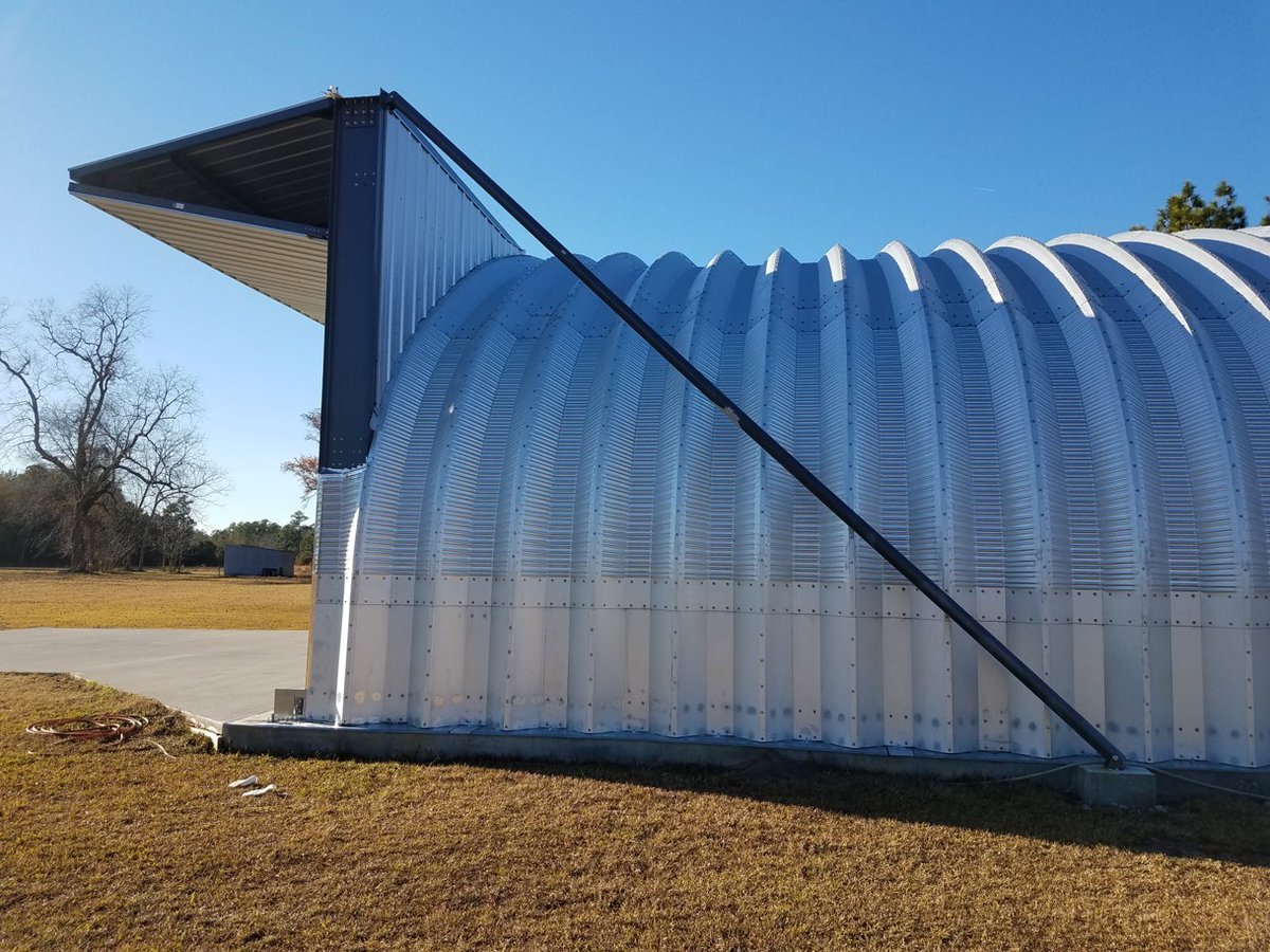 The Self-Supporting Header is designed to handle all weight and loads of the door. The only load that is transferred back into the building is the outward pull which is created when the door is in the open position. Tie-back cables are provided to transfer this outward pull.