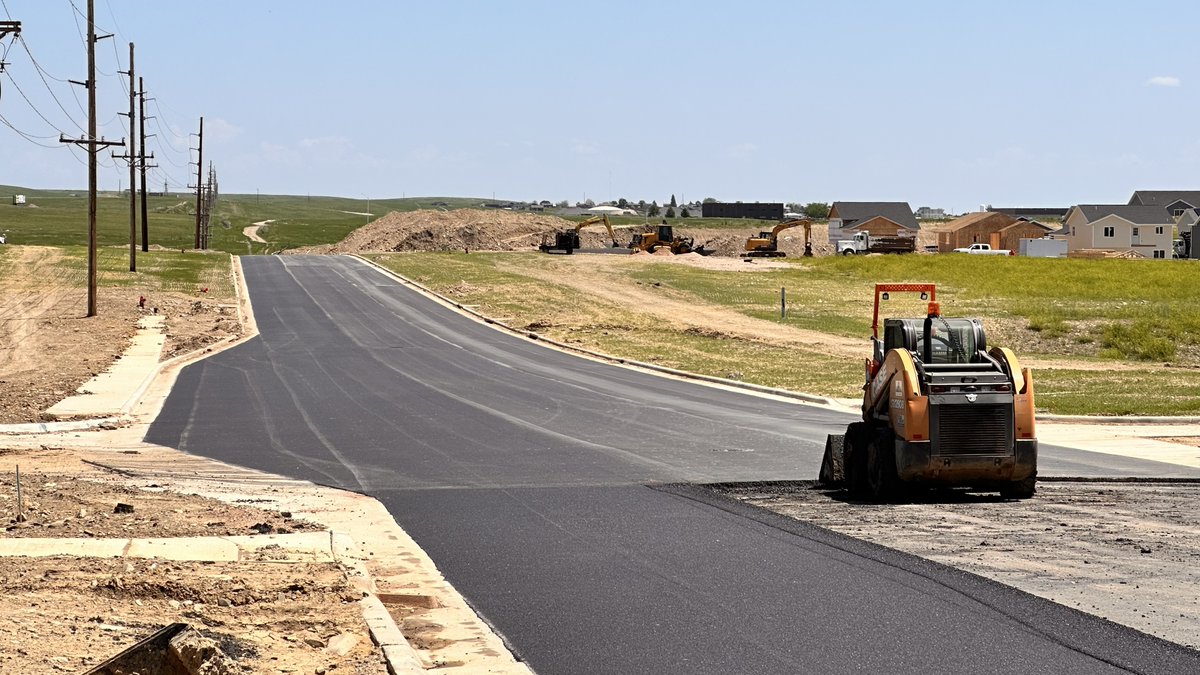 DreamDesignIntl's tweet photo. Hot days, and even hotter asphalt! 🚧🌞

East Anamosa Street is getting a fresh layer of asphalt this week. And did you know that asphalt is around 300 degrees when it's being laid? Talk about HOT! https://t.co/LlaBgsHan8