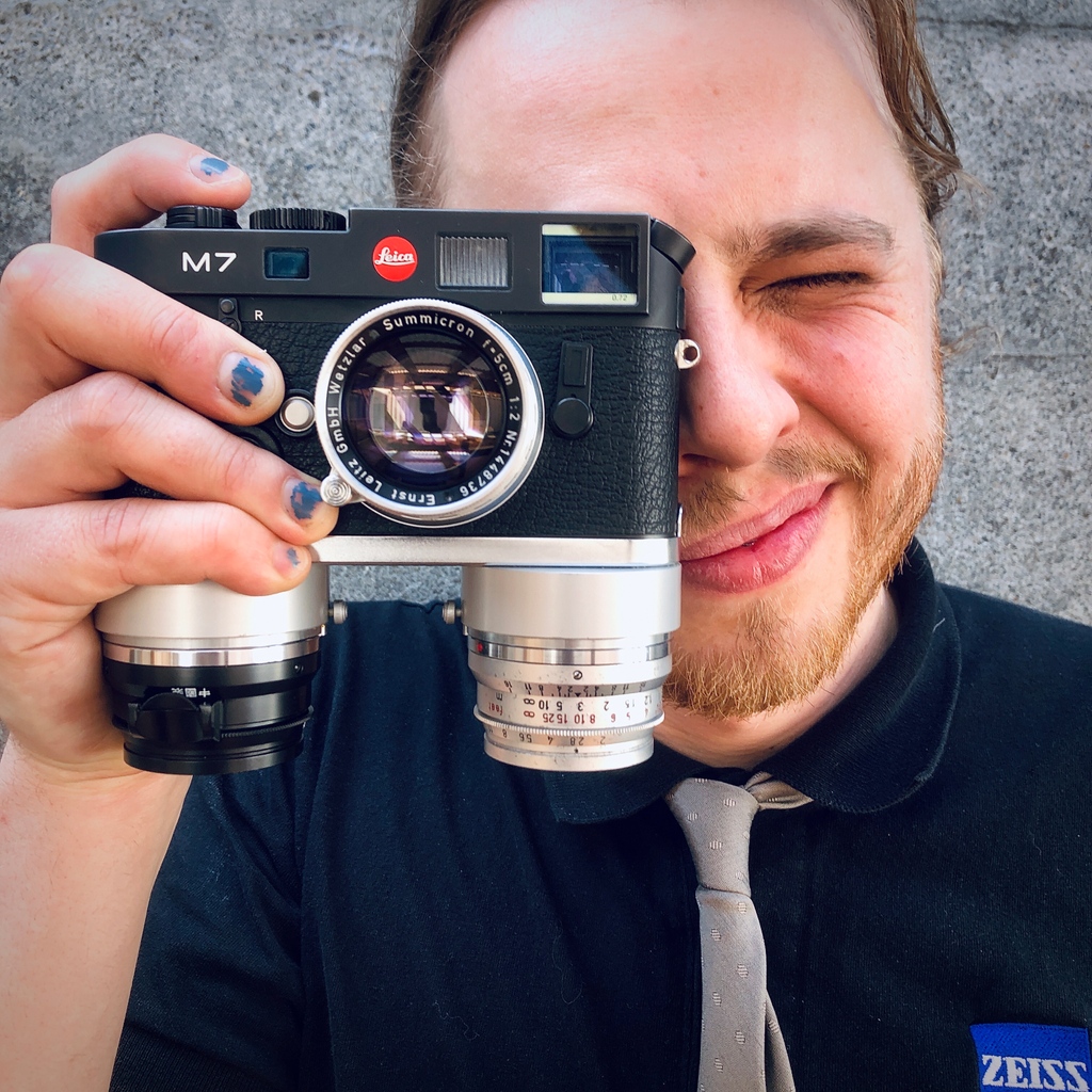 bluemooncamera's tweet photo. This Benser Dual Plate is one of the most unique items we have in stock currently. Slipping over the baseplate most M's (like this sharp M7), it allows two lenses to attach to the bottom. It looks strange but actually works well, facilitating quick changes between lenses. https://t.co/AQFh3Hz7bS