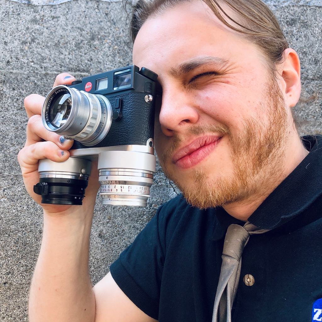 bluemooncamera's tweet photo. This Benser Dual Plate is one of the most unique items we have in stock currently. Slipping over the baseplate most M's (like this sharp M7), it allows two lenses to attach to the bottom. It looks strange but actually works well, facilitating quick changes between lenses. https://t.co/AQFh3Hz7bS