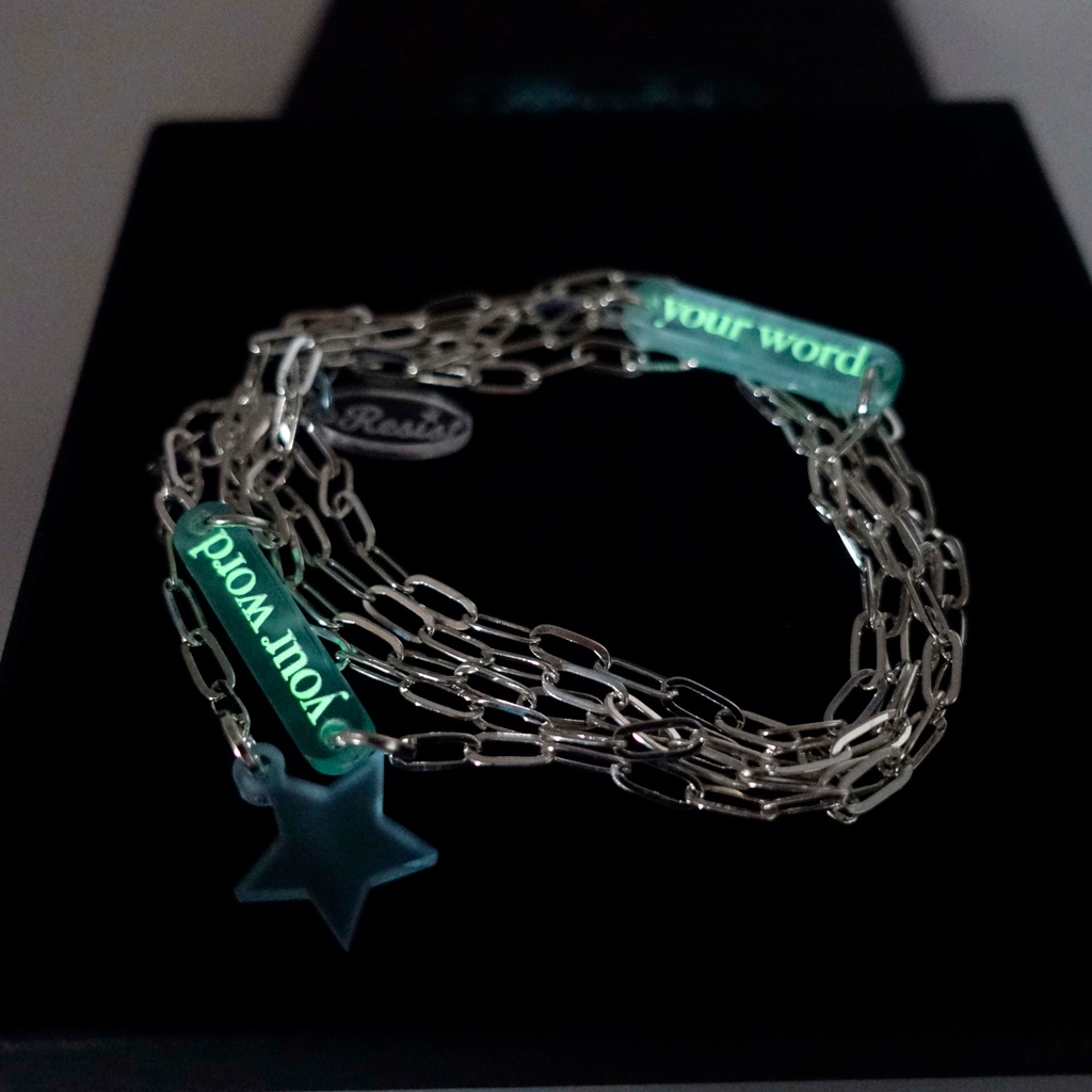 Have any set of words you'd like engraved in glow in the dark pigment on a choice of silver or gold-plated paperclip chain, and finished with a charm of your choice, to wear as a necklace, choker or bracelet. ⁠ £2 goes to @4refugeewomen