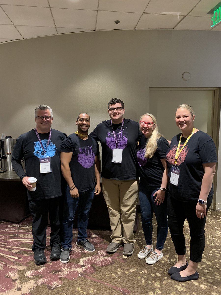 DOECyberForce's tweet photo. When at #NISTConference and the swag is 🔥 you have to take photos and commemorate the last few year #CyberForceCompetition shirts. #dresstoimpress https://t.co/Ya8uv9DYMk