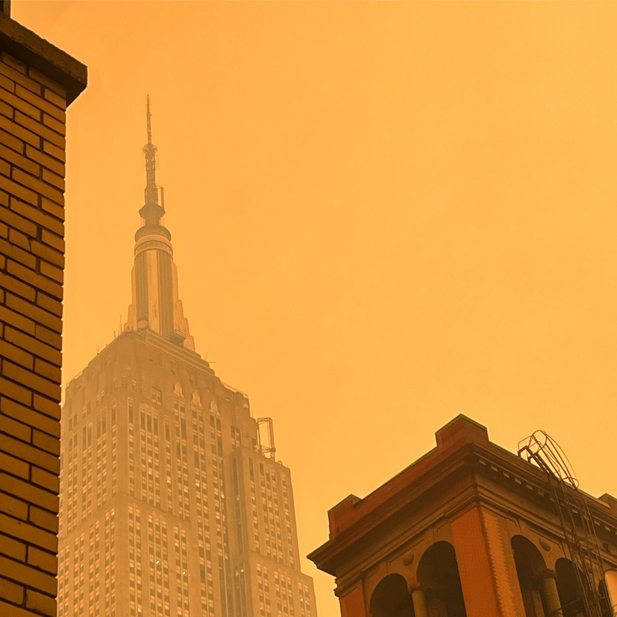 2pm midtown Manhattan. The air is yellow. #climatechange #globalwarming