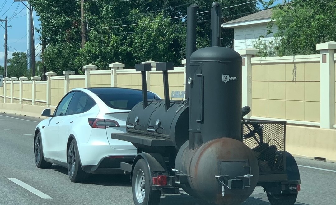 Y'all, it simply doesn't get more 2023 Austin than a Tesla towing a smoker down MoPac