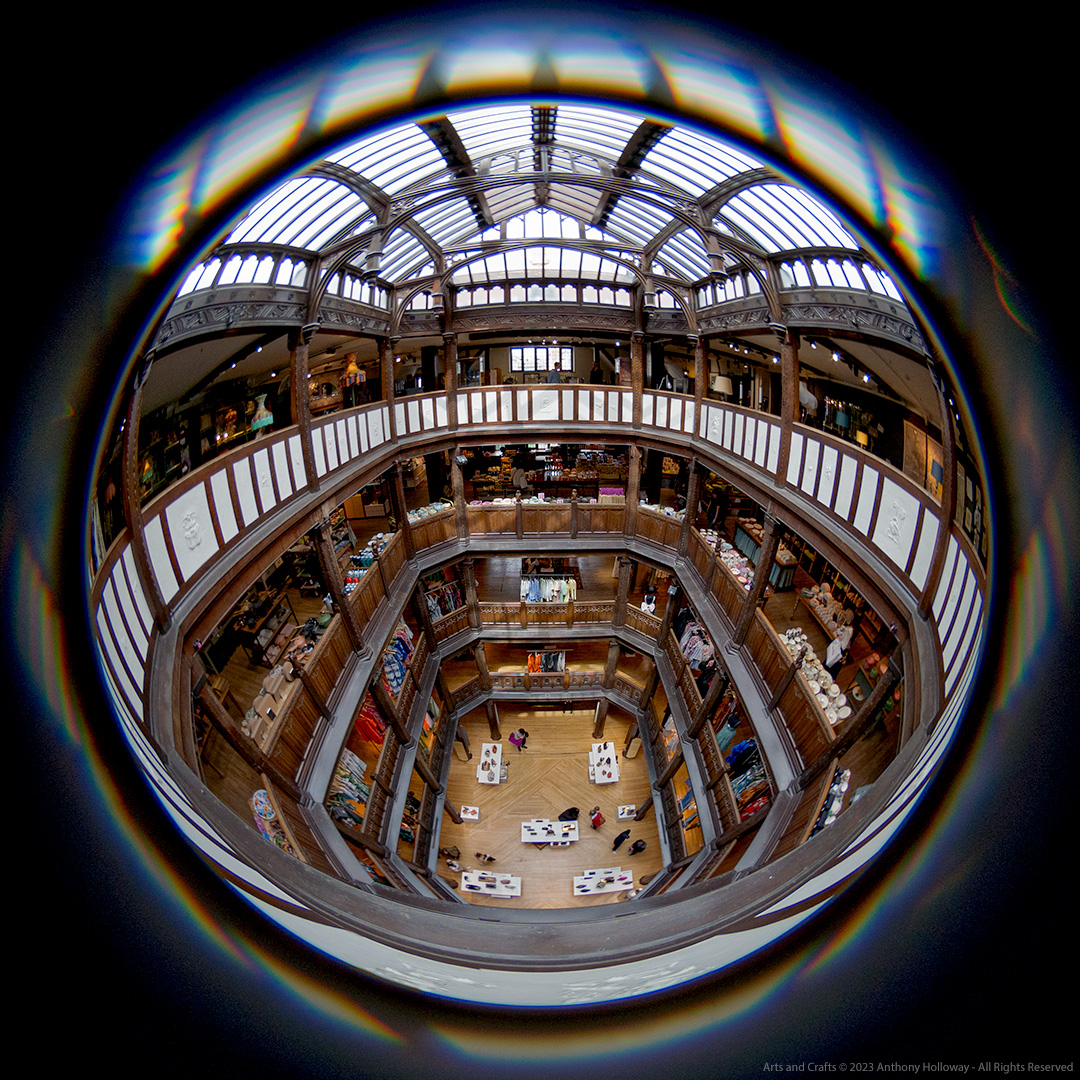 'Arts and Crafts' - A fisheye view of the central atrium of the Liberty store off Regent Street in London, built in the 1920's at the time of the Arts and Crafts movement. 
Sony A7III/Lensbaby Circular Fisheye

#fisheye #lensbaby #sonya7iii #London #architecture