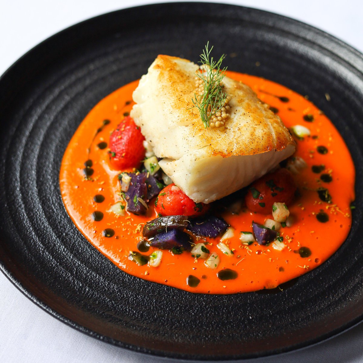 Butter Fish • tomato vinaigrette, purple potato, fennel, pickled mustard seed