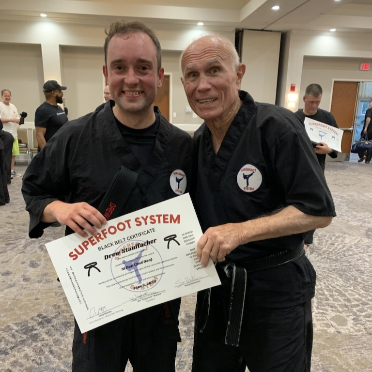 9Round's tweet photo. #9RoundNation, help us congratulate our very own, Drew “The Captain” Stauffacher, for earning his 2nd-Degree Black Belt through the Superfoot System! 🥊 💪 🥳 We're so proud of him for CRUSHING this rigorous test and embracing one of our 9Round Core Values—Kaizen, which means... https://t.co/p3BnBKlHK1