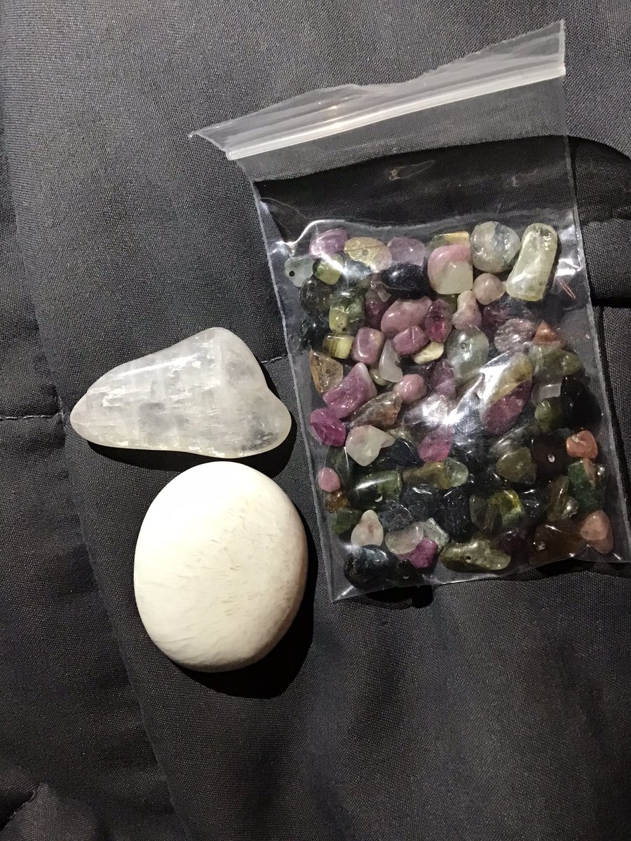I haven’t gotten any new rock friends in a long time. These came in the mail today: a pink petalite (who’s prettier in person and has rainbow flashes) and a nice worry stone sized scolecite. The lady I got them from sent a baggy of different colored tourmalines, too.