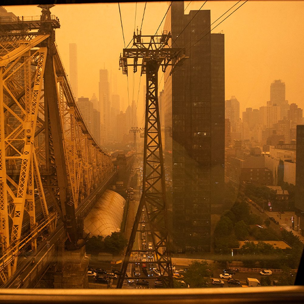 FoxNews's tweet photo. DANGEROUS LEVELS: New York City skyline turns orange with most toxic air in its history, and the "worst is yet to come." https://t.co/4ajgtWJ9xW https://t.co/w4Ysa70NIj