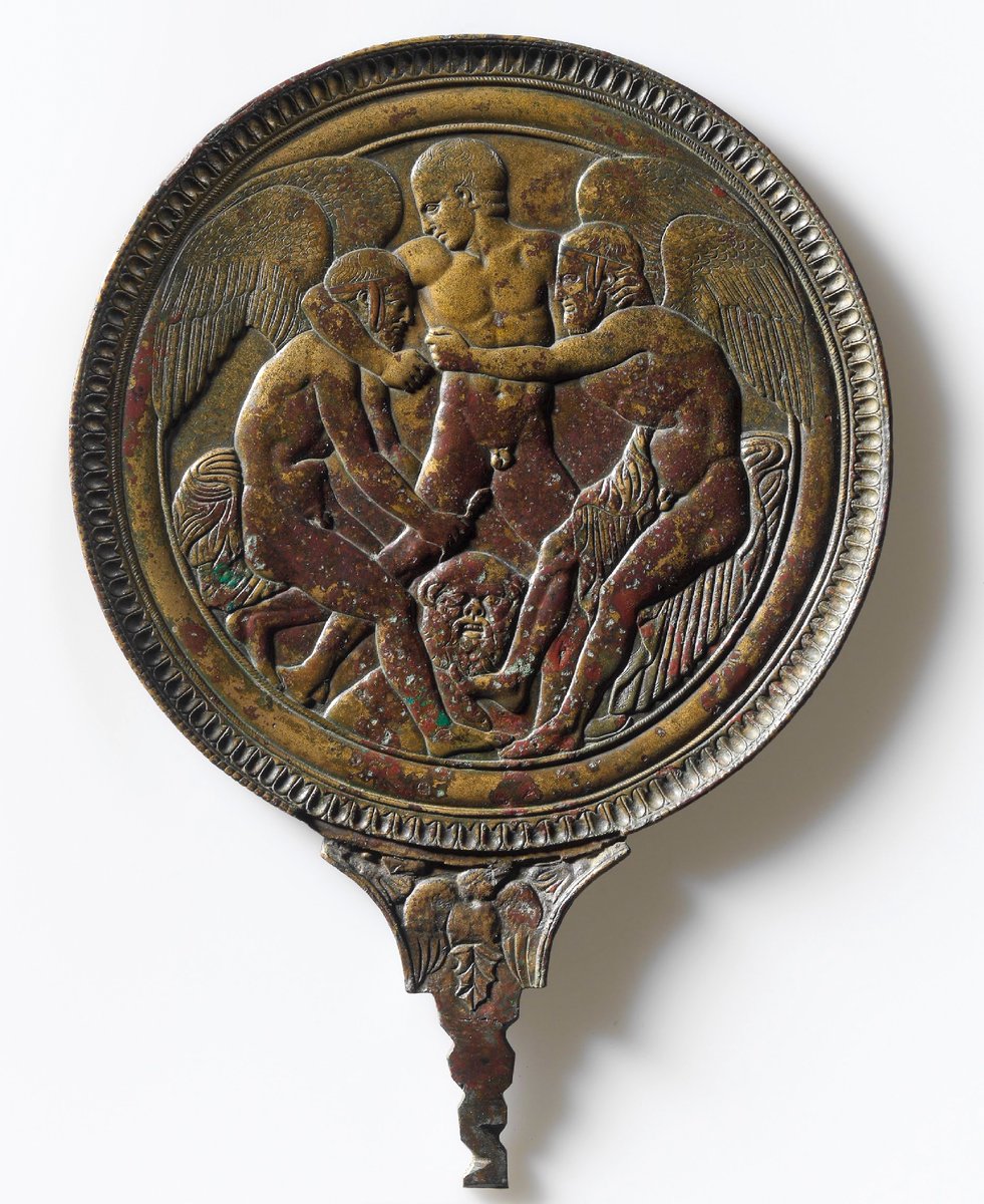 chapps's tweet image. Late for #ReliefWednesday! Today, a wonderfully preserved 5th c. BCE Etruscan bronze hand mirror depicting the struggle between the giant metal automaton (robot!) Talos and the winged sons of Boreas. Talos attempts to pull them godlings his red-hot chest. #AltesMuseum @amayor  1/