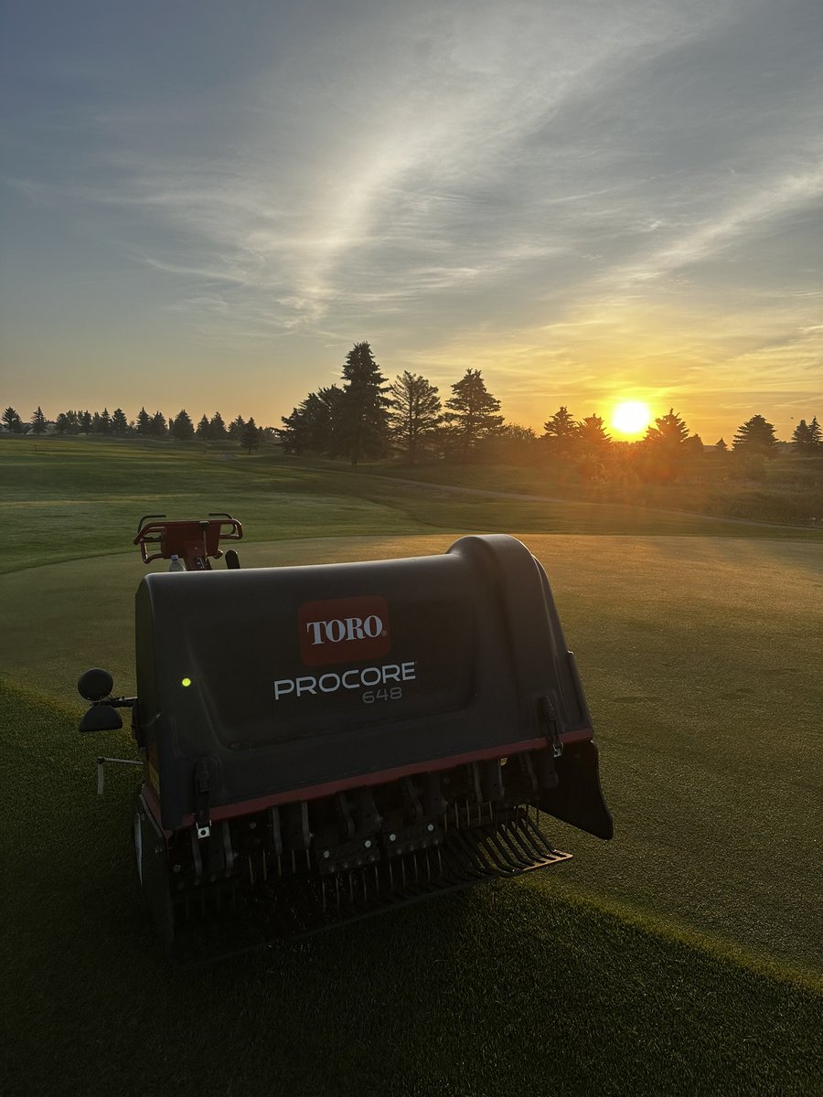 Ryalin95's tweet photo. Bit of early morning aerating, punching some holes into the dry spots on greens and collars to help get that much needed water in for this 29° heat the next few days. Sunrises here hit so different compared to home 🌅 

#greenkeeper #assistantsuper #turftwitter #strathmore https://t.co/MidIKLnJQP