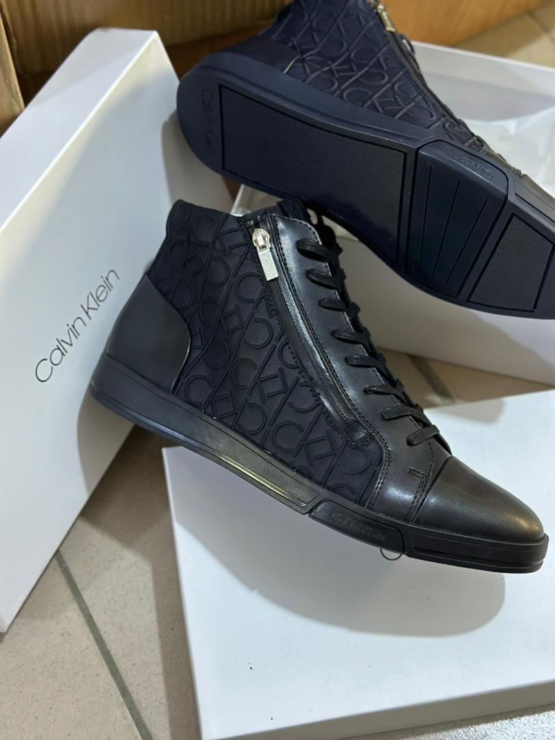 ignite your sneaker game with Calvin Klein Berke Leather High Tops! Crafted with premium leather, these sleek and sophisticated high tops will set your style on fire. Order now and unleash your impeccable fashion! 🔥 Price: GHC430.99 Sizes: 40-45 #CalvinKlein   #soles4souls