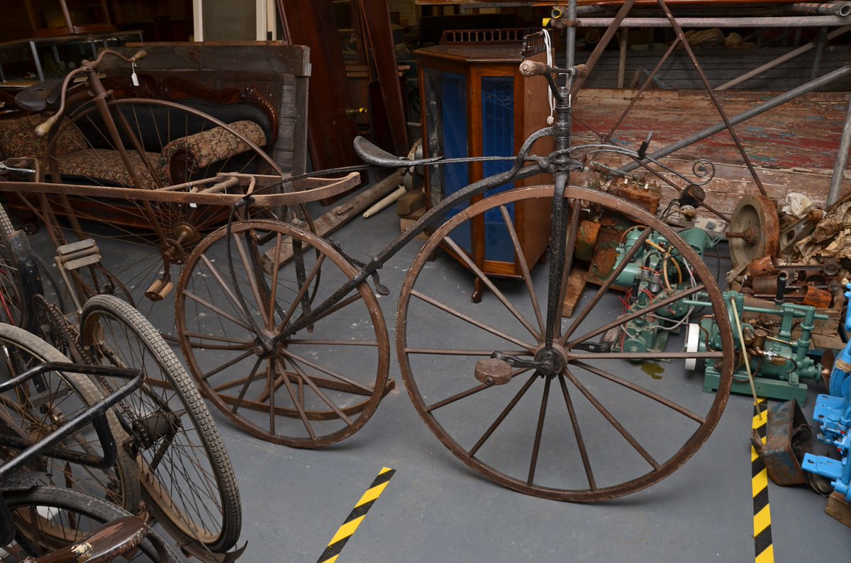 JerseyHeritage's tweet photo. t’s #BikeWeek100, which marks a century of celebrating #Cycling. We have over 30 different bicycles in our collection, including two C19th ‘boneshakers’. The first bikes with pedals, they had an iron frame and wooden wheels. Heavy and uncomfortable to ride!  

#MeetTheCollections https://t.co/Rynhc8gi5D