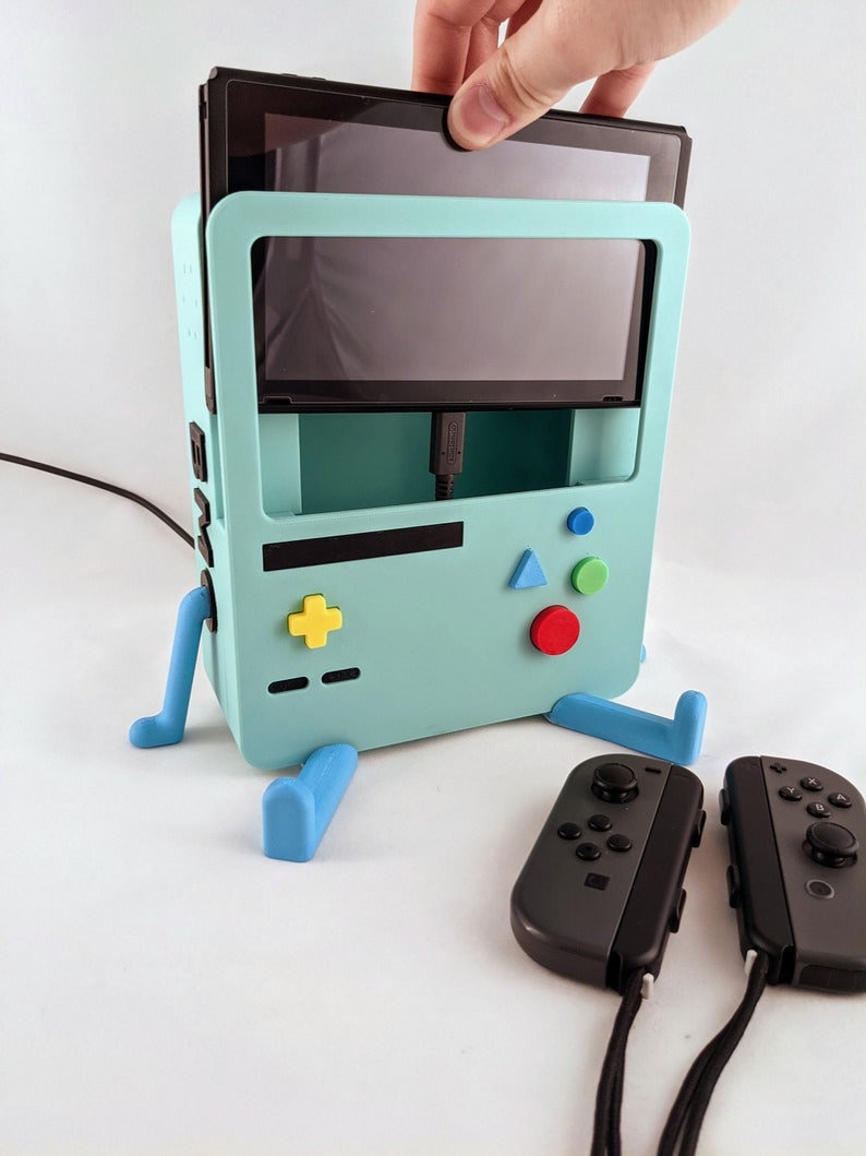 #etsy: Adventure Time BMO Nintendo Switch ORIGINAL + OLED Charging Station Holder Stand - Cute finn jake Gamer Gift etsy.me/43KCZFC #adventuretime #bmoswitchdock #boygift #christmasgift #dockingstation #girlgift #nintendoswitchdock #switchdock #switchstand