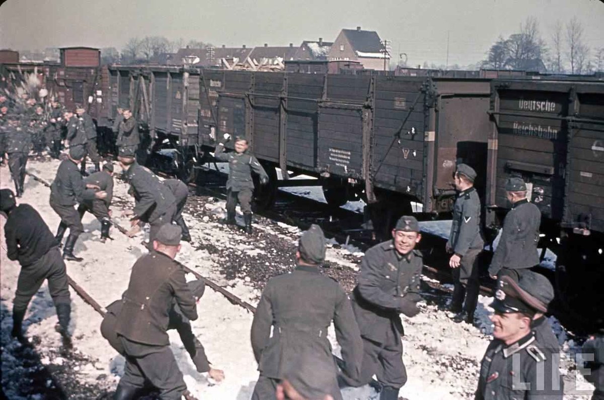 vintagestuff4's tweet photo. Wehrmacht soldiers having a snowball fight in a train yard while awaiting deployment (France, 1944). https://t.co/Q891o7nV7w