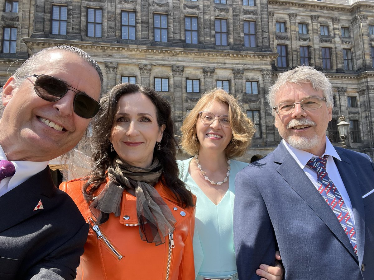 In front of the Royal Palace (Netherlands) with our spouses before our Palace Symposium hosted by His Majesty and Her Royal Highness.