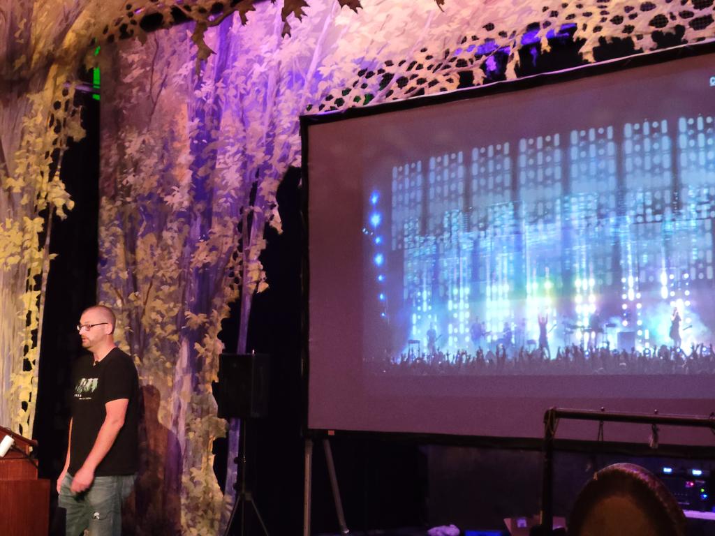 nirvdrum's tweet photo. I'm really enjoying the NIN theme in the #BlueRidgeRuby by @kevin_j_m. He's got the tour shirt on, photos of the band on the slides, and the slide titles are song titles. https://t.co/uaTE0j8uAC