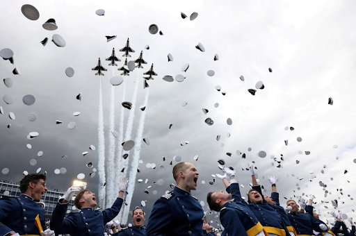 sundaylongread's tweet photo. Photojournalist @KevinMohatt delivered an exhilarating trifecta of a photo (of the U.S. Air Force Academy graduation ceremony) by capturing the Thunderbirds’ flyover, the ceremonial hat toss, and the open-mouthed glee of graduates in one shot. #SundayStill https://t.co/IgAWvdWXOE