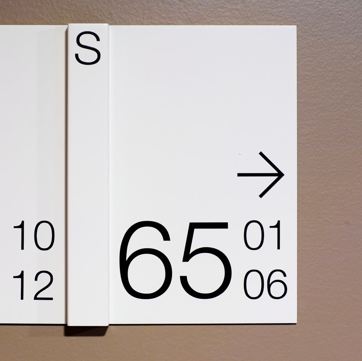 Looking for sleek, modern, and minimalist signage for your building's interior? Our firm specializes in creating directional signage that not only guides visitors but also adds to the overall aesthetic of the space.