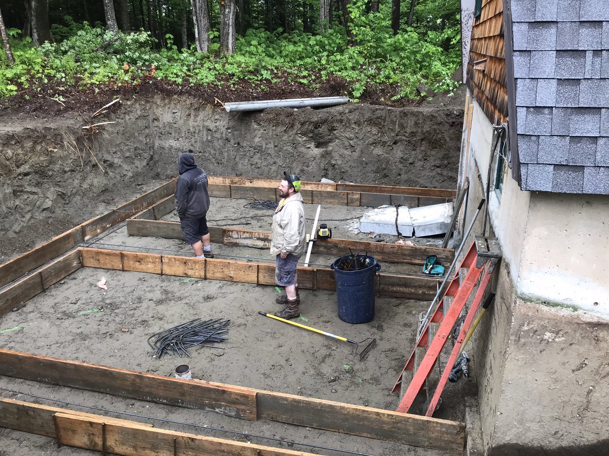 Workmen are beginning to set up for pouring the basement.  First the door had to be cut in the old foundation.  It landed with a loud thump & was hauled out of the hole with chains & backhoe.