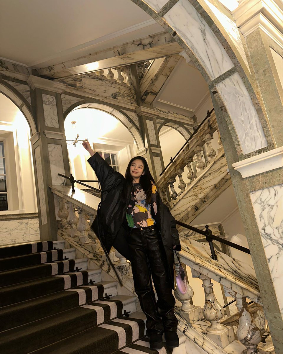 Clothed in a printed garment adorned with a layered artwork design at the back, my focus was diverted as I was interrupted by the intrusion of age-old carvings into my photographical endeavor. Stationed atop the stairs, I exerted a modicum of energy to satisfy my vantage point.