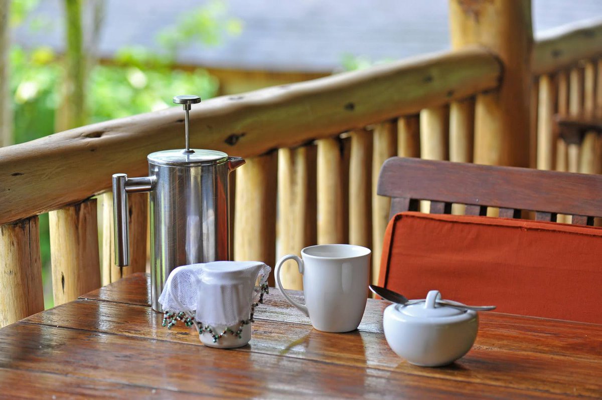 Enjoy a coffee on your private veranda while you view the lush Bwindi Forest area. #BuhomaLodge