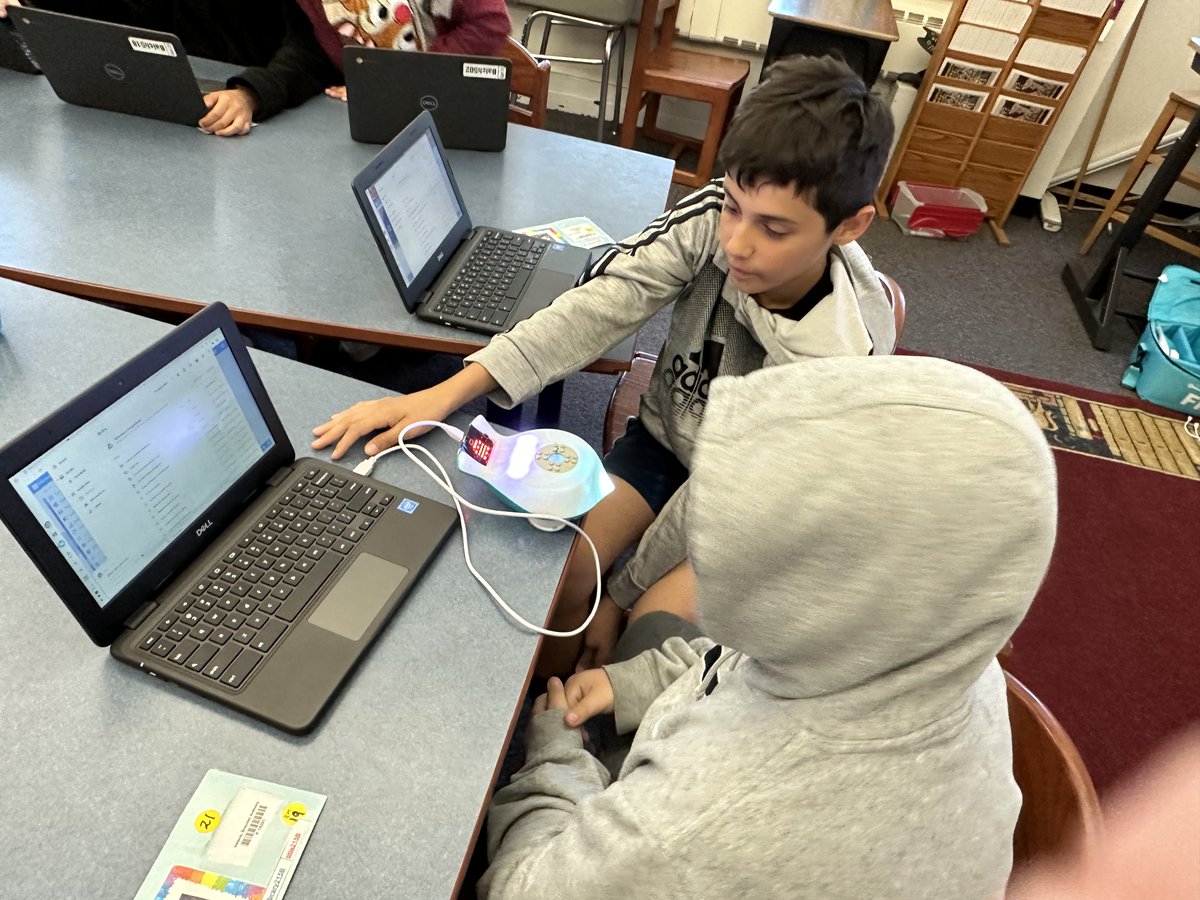 5th grades discovering how to "code" Finch robots in Library Classes.