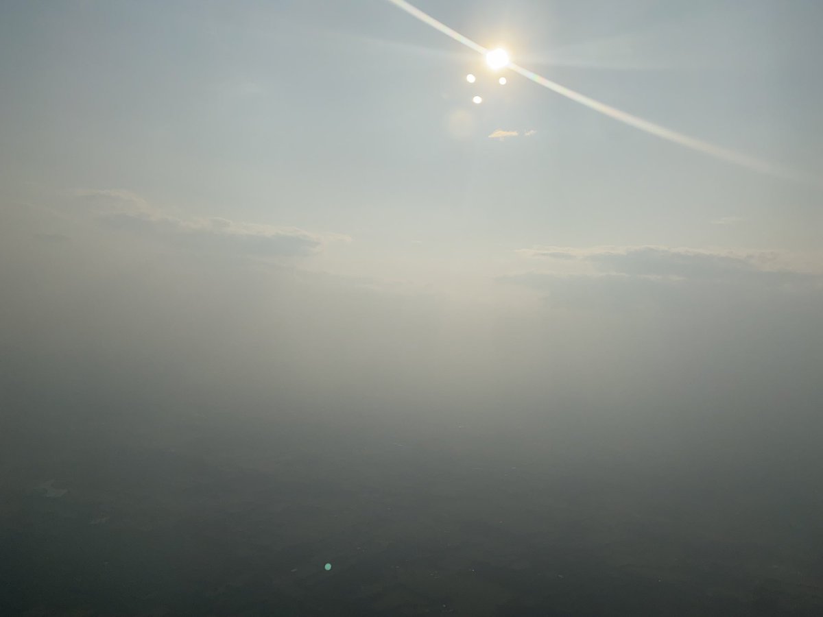 MEGehring's tweet photo. That’s smoke!  So crazy to come back to this on the heels of talking #airquality @AirandWaste #AwmaACE23 this week in Orlando.  Our conversations on health risks, air quality, and climate change are right out the window for all to see today! https://t.co/ZkyAwlHrGP