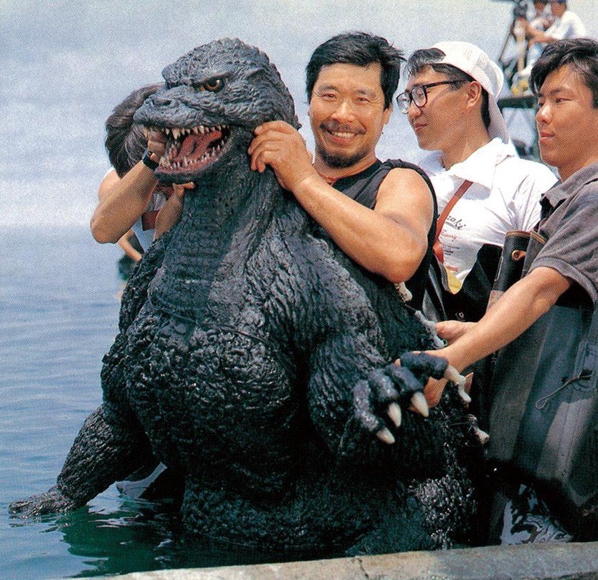 Heisei Godzilla suit actor Kenpachiro Satsuma smiles for a photo while filming Godzilla Vs. Mothra(1992)