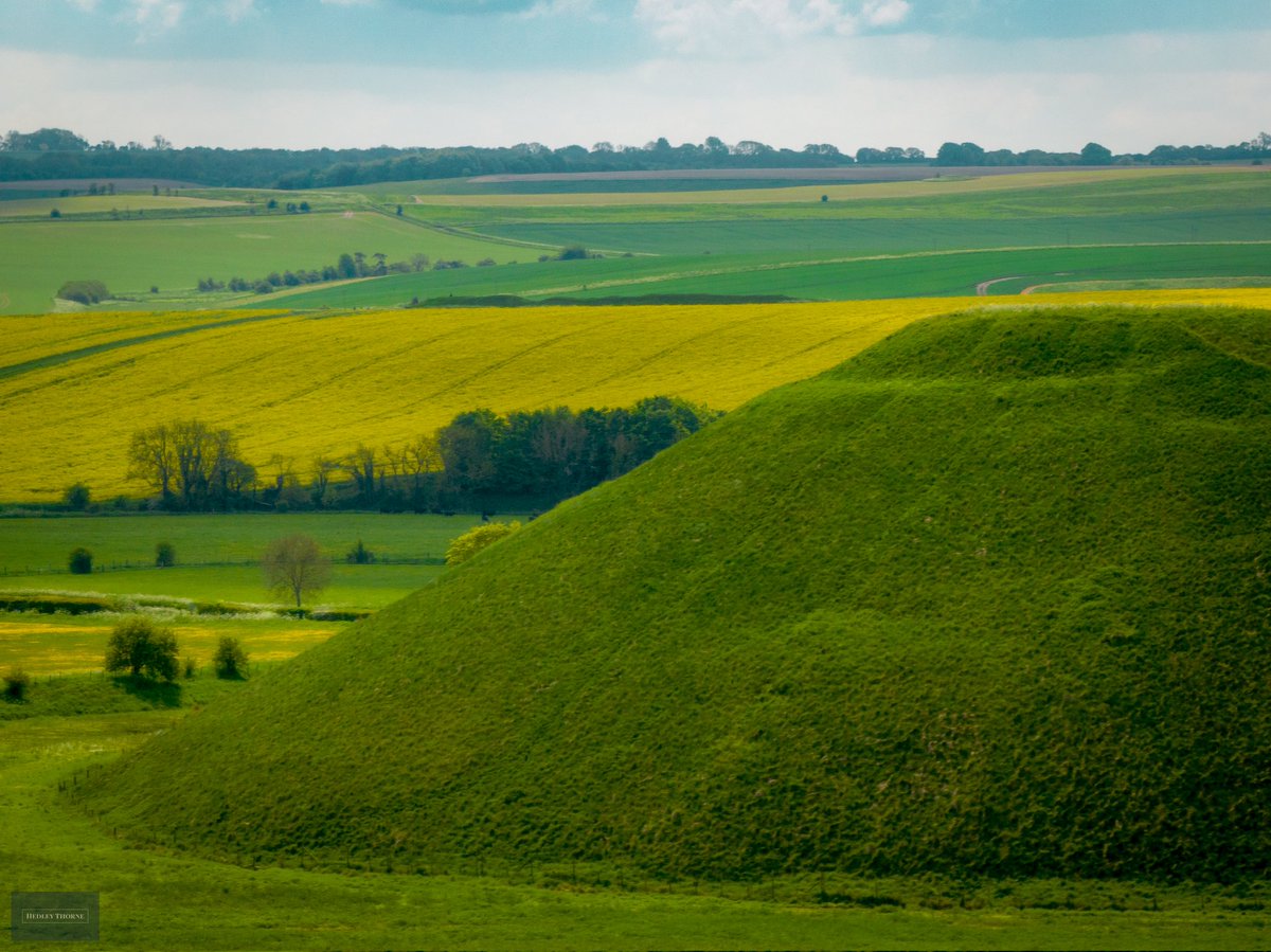 Silbury Hill with West Kennet Long Barrow in the distance. HedleyThorne.com
