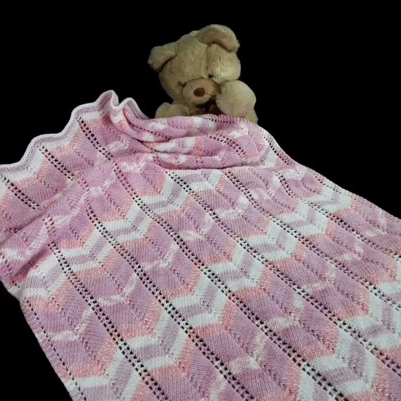 Hand knitted baby pram blanket - pinks and white Chevron Afghan - pram cover buff.ly/3qkPOYK #knittingtopia #etsy #uksmallbiz #handmade #babyblanket #WomenInBiz
