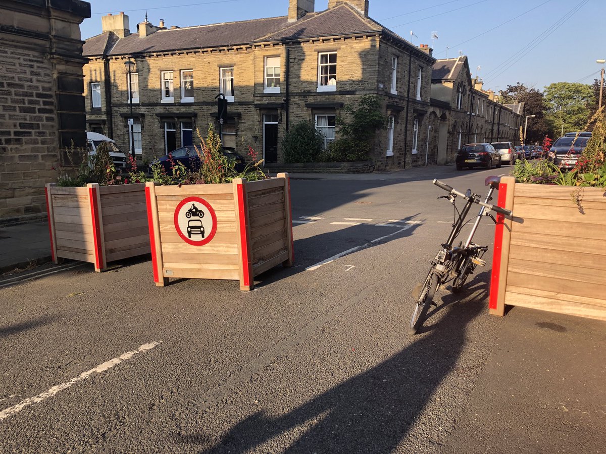 NRKPRX's tweet photo. @bradfordmdc @DarrenBar88 Looks like someone has moved the ATN planter on Titus Street in Saltaire (looks like to allow car to pass). Could it be moved back, please? (I did actually try, but unsurprisingly it’s REALLY heavy). https://t.co/VLGffD9Ehf