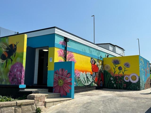 Local residents in Saltdean, Brighton, funded a mural on  their public toilets. Art for all, brightens a community, inspires a smile, not art for wealth in locked vaults or toffs' private houses.