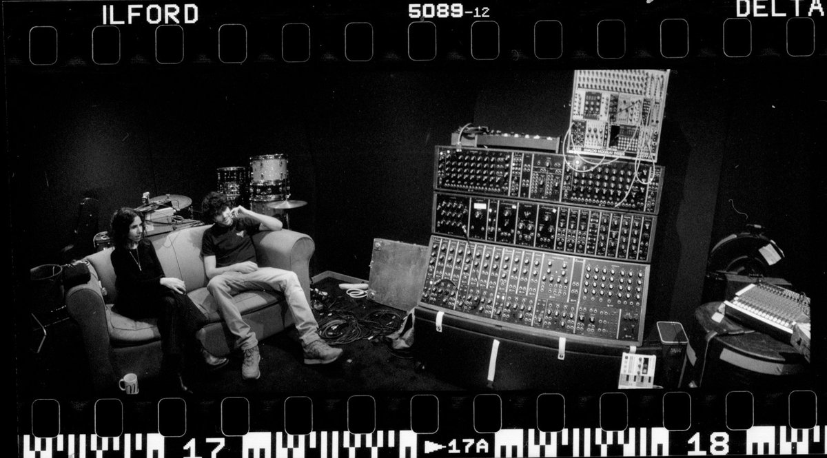 PJHarveyUK's tweet photo. "Here Colin and I are pictured in the studio amongst Flood's array of equipment."

📸 #SteveGullick #iinsidetheoldidying #iinsidetheoldyeardying

https://t.co/XuCBfQhefG https://t.co/Oe9WeP9AAV