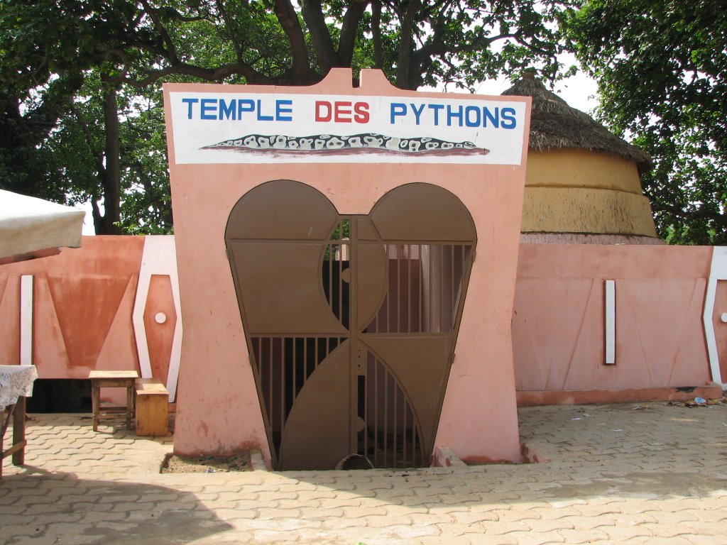 Pythons Temple is a sacred shrine in the city Ouidah,Benin Republic.A church is directly in front of the shrine. In Ouidah you can drape the python around your neck,the royal phytons are harmless.couldn't put the smallest on my neck harmless or not..WOW Le Bénin est incroyable🇧🇯